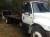 2002 International 4400 Flat Deck Tow Truck Wrecker - Image 1